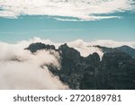 clouds falling over the high Mountains