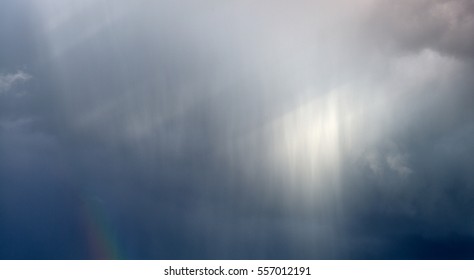 Clouds And Falling Rain With Slight Rainbow, Derbyshire, UK