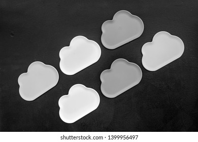 Clouds figures for cloud storage on black background top view