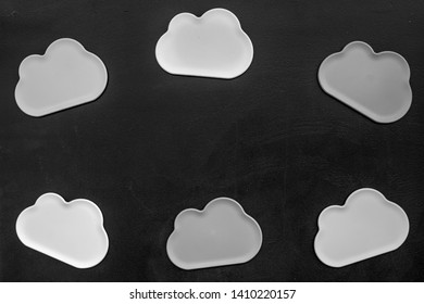 Clouds figures for cloud storage on black background top view mockup
