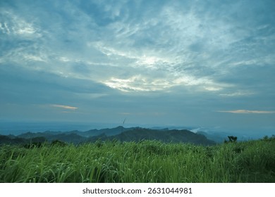 Clouds float over the lush green hills and forest of Marayan Tong, Bandarban, Bangladesh — a stunning mountain travel destination with mist, sky, and serene nature.
