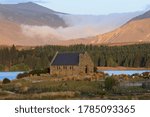 Clouds flowing down the mountains behind the Church of the Good Shepherd in Tekapo, New Zealand.