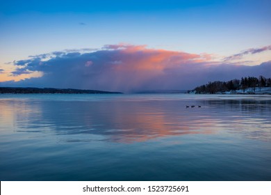 Clouds Form Over Skaneateles Lake, Skaneateles, A Popular Vacation Destination In The Finger Lakes Region Of New York State, USA, Before Sunset On A Winter Day.