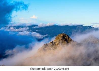 Clouds hovering around the surrounding peaks