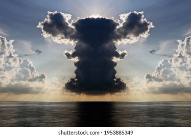 The clouds are multicolored, thunderous bizarre shapes against the blue sky and the sun above the ocean surface. Seascapes.