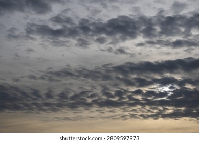 clouds obscuring the setting sun
