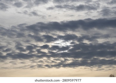 clouds obscuring the setting sun