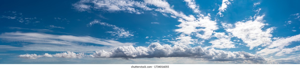 Clouds on blue sky background, ultra wide panorama