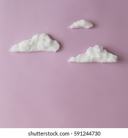 Clouds On Light Purple Background. Creative Concept. Flat Lay.