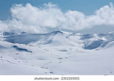 Clouds on a sunny day in distance in backcountry in Charlotte's Pass ski resort in New South Wales in Australia - Powered by Shutterstock