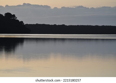 Clouds Over Calm Lake Water