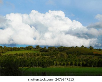           clouds over fields in a rural area
