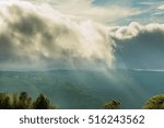 clouds over hill