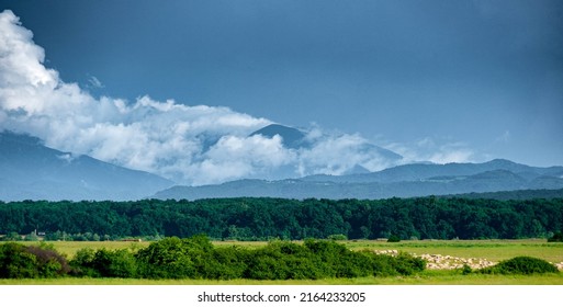 clouds over mountain range in the evening