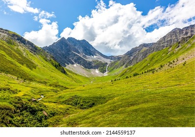 Clouds over a mountain valley. Beautiful mountain green valley landscape. Mountain landscape. Mountain valley view