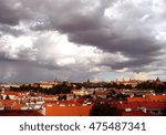 Clouds over Prague with red roofs