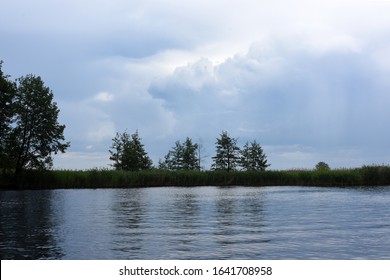 clouds over the river and forest