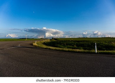 Clouds over road with moon