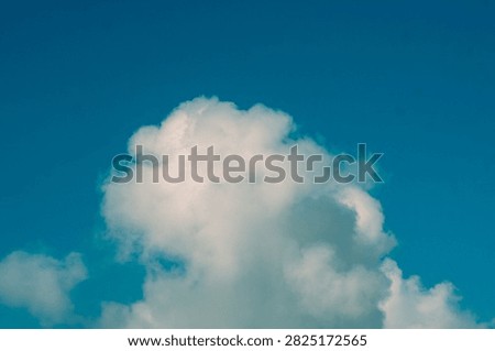 Clouds overus and clear blue sky