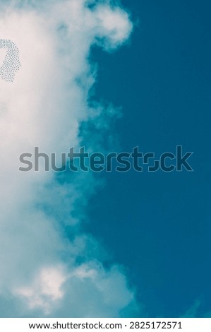 Clouds overus and clear blue sky