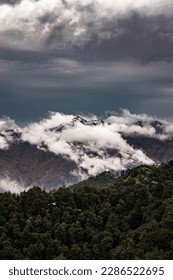 Clouds passing through a mountain