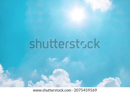 Clouds patterns with sun on bright sky background 