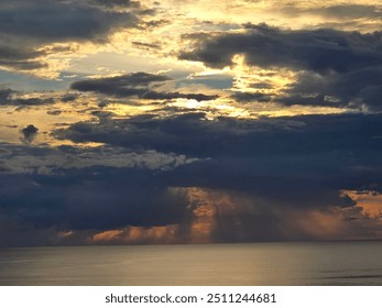 Clouds raining down on the ocean