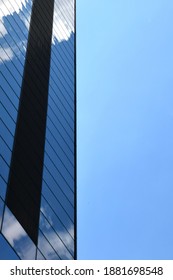clouds reflected in a building