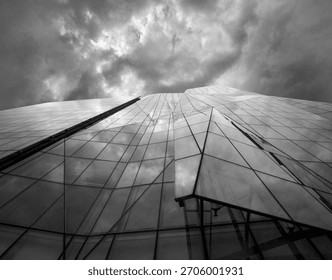 CLOUDS REFLECTED IN GLASS SKYSCRAPER