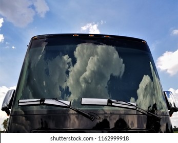 Clouds Reflecting On RV Windshield