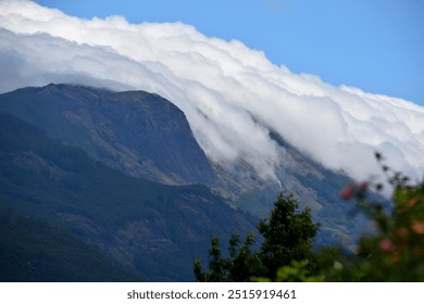 Clouds rolling down the mountains