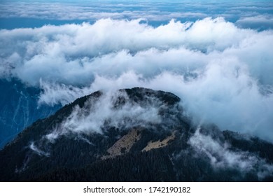 Clouds rolling over the hill