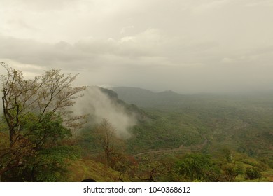 Clouds Rolling Over Mountain