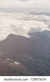 Clouds rolling over mountain landscape
