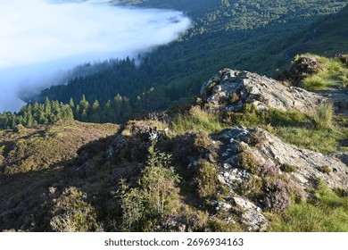 Clouds rolling in over mountain side