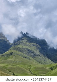 Clouds rolling in over a peak
