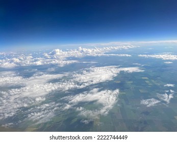 clouds in the sky from airplane window