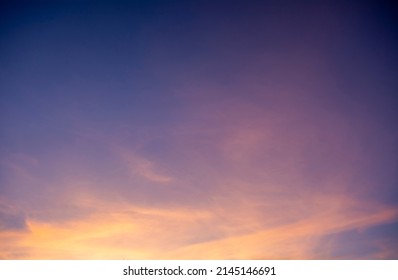 Clouds in the sky lit by the setting sun. - Shutterstock ID 2145146691