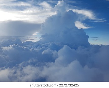 clouds up in the sky pictured in plane
