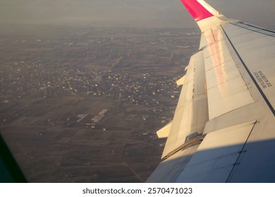 Clouds and sky as seen through window of an aircraft