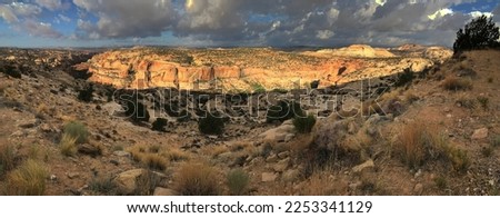 Clouds spread over buttes in a panoramic view of Escalante Grand Staircase National Monument, Garfield County, Utah