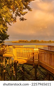 Clouds in summer dawn heavenly sky over lake wooden deck overlook - Shutterstock ID 2257965611