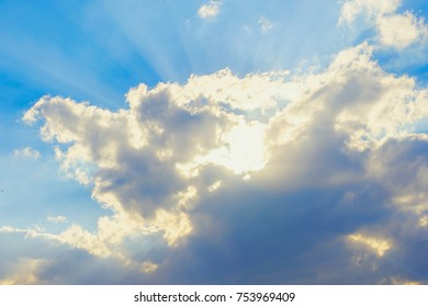 clouds and sun rays and blue sky