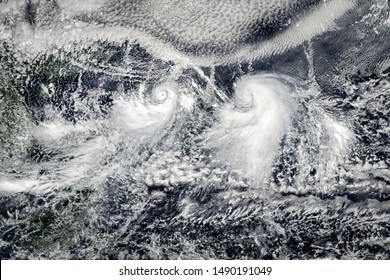 Clouds with tornadoes, view from space. Elements of this image furnished by NASA. - Powered by Shutterstock - Get 15% off with code: PIKWIZARD15