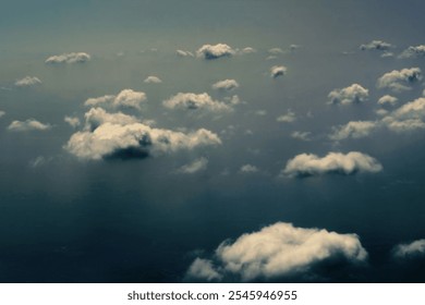 Cloudscape from above. Dark sky with fluffy clouds real artistic photo. Candid atmospheric moody, flying or floating over the clouds ethereal concept. - Powered by Shutterstock