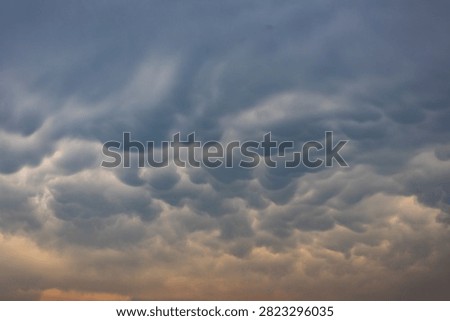  A cloudscape image of mammatus cloud formation at sunrise.