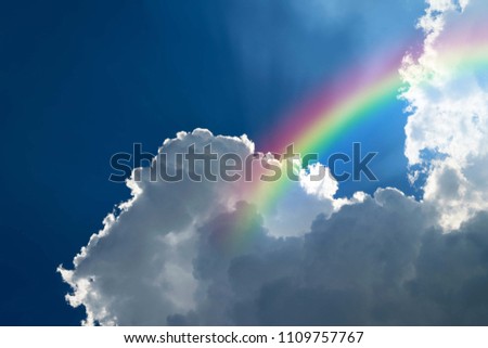 Cloudscape rainbow of natural sky with blue sky and white clouds and colorful rainbow in the sky use for wallpaper background