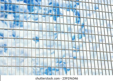 Cloudscape reflected on building windows. Abstract shot and textures.