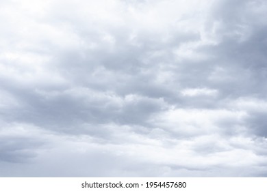 Cloudscape Scenery, Overcast Weather Above Dark Blue Sky. Storm Clouds Floating In A Rainy Dull Day With Natural Light. White And Grey Scenic Environment Background. Nature View.