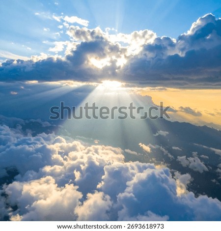 Cloudscape with sun rays breaking through clouds showing divine natural light